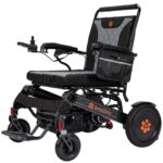 Bangeran Mammoth EX folding power wheelchair in black and orange front three quarter studio view